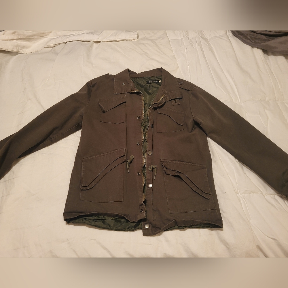 Green jacket with cute detail.